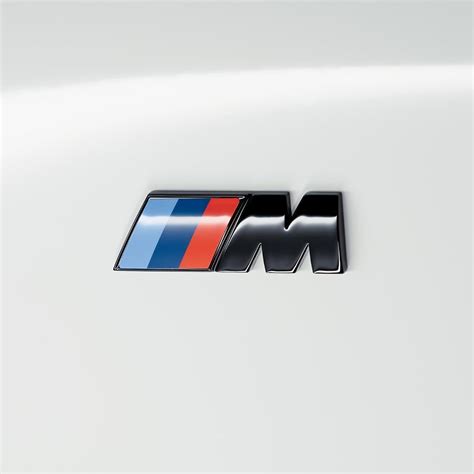 portrait of black high gloss M logo on car